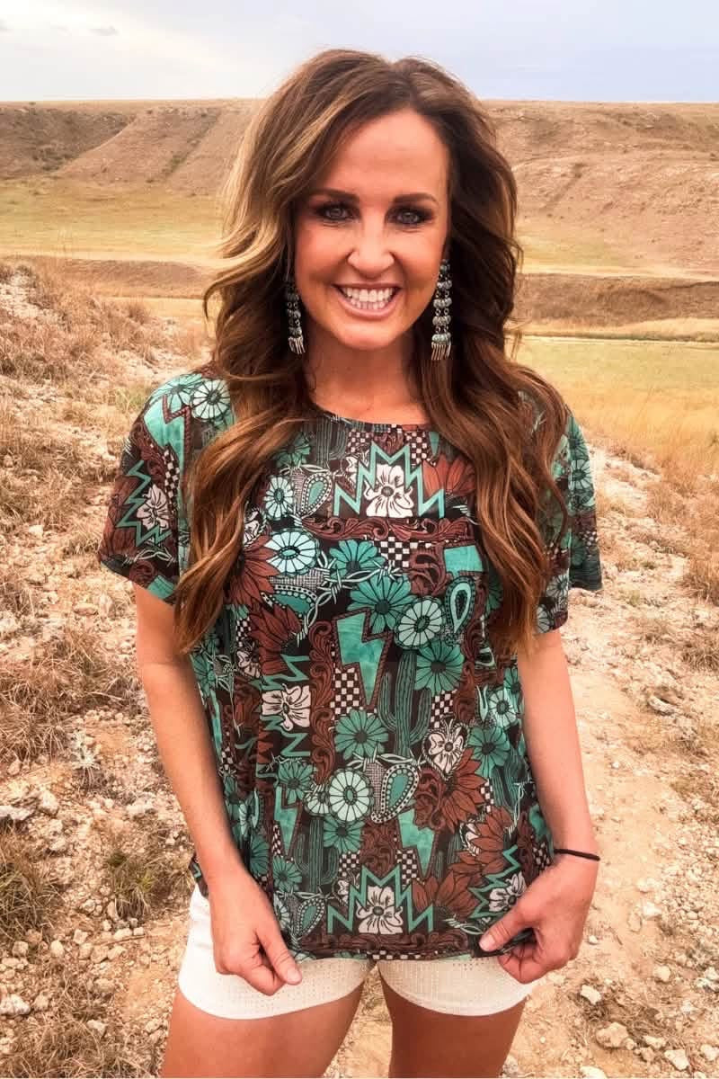 Tattoos and turquoise top